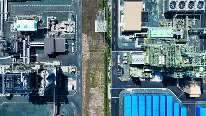 An industrial area lined with factories directly above aerial view.
