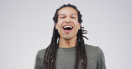 Portrait, laughing and man in studio for comic emotion, joke and silly on white background space....