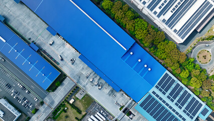 An industrial area lined with factories directly above aerial view.