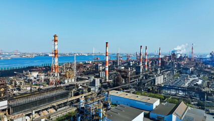 Obraz premium plant, aerial view, factory, petrochemical complex, steel mill, industry, drone, bird eye view, blue sky, environment, manufacturing, monodzukuri, japan, chimney, industrial area, technology, infrastr