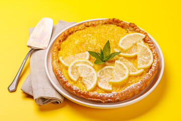 Delicious lemon tart with golden crust and smooth, glossy lemon filling
