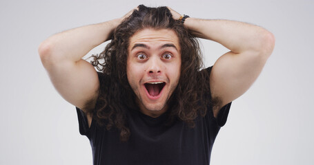 Shocked, man and mouth open for gossip, portrait or amazed by announcement, listening or...