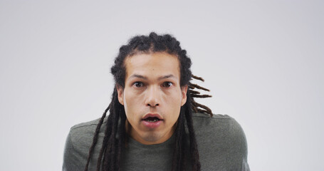 Portrait, man and shocked emotions in studio for fake news, bad rumor and gossip drama. Male...