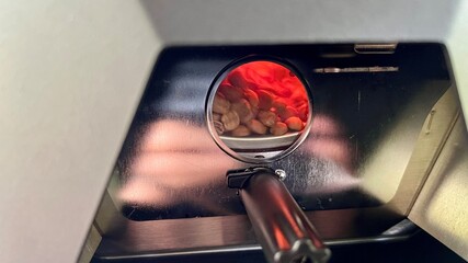 Close up coffee machine with coffee beans and magnifying glass