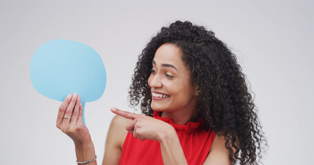Pointing, speech bubble and woman in studio, feedback and announcement on white background. Person,...