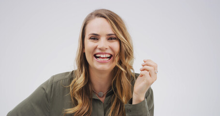 Portrait, laugh and woman in studio for comic emotion, joke and silly on white background space....