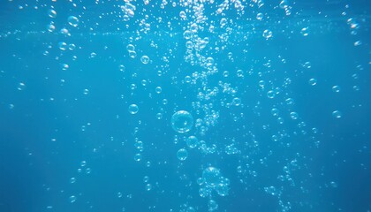 Naklejka premium Bubbles rising in a clear blue aquatic environment underwater scene