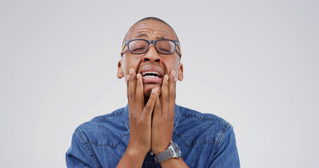 Emotional, black man and crying with grief in studio for bad news, mourning loss and breakdown....