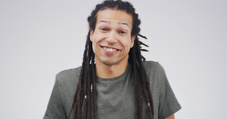 Portrait, happy and creative man in studio as confident copywriter for business. Worker, dreadlocks...