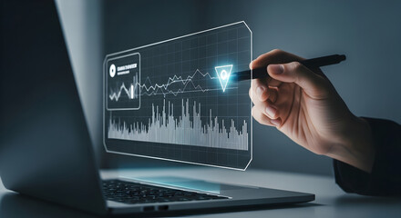 Human hand precisely navigates a dynamic holographic data screen with a stylus, showcasing digital analytics.