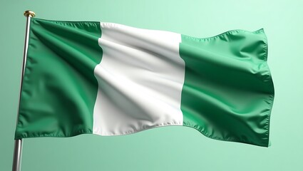 Obraz premium The Nigerian flag waving against a light green background, showcasing its green and white stripes.