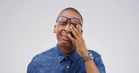 African man, crying and sad in studio with depression, grief or loss with emotion on white...