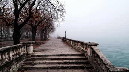 Fototapeta premium Misty morning on the music island in the Danube River, showing empty stage and calm ambiance, space to add text