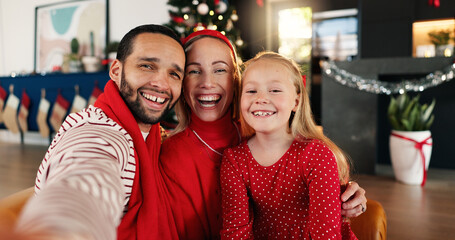 Christmas, happy and selfie of family in living room of home together for celebration or memories. Excited, POV or smile with husband, daughter and woman in apartment for festive profile picture