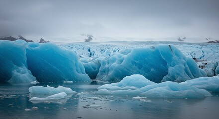 Icebergs Floating in Cold Glacial Water Under Overcast Sky