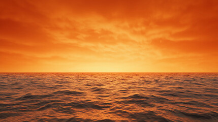 A vibrant orange sunset casts a warm glow over a calm ocean with gentle waves rolling under a cloud-streaked sky.