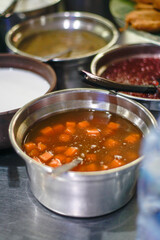 Traditional Indonesian Sweet Yam Porridge in a Stainless Bowl