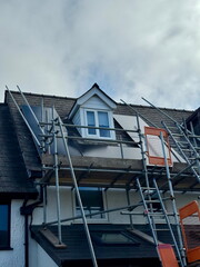 Retrofit installation of solar panels on a rooftop terrace house uk ensuring renewable energy efficiency and sustainability highlighting clean energy and environmental benefits.
