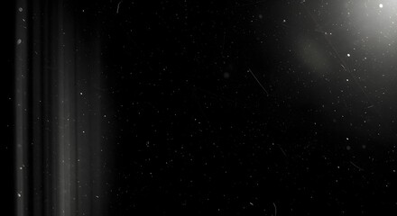 Obraz premium Abstract dark background with light leaks, dust particles, and cinematic grunge texture