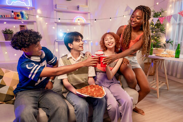 Group of diverse Generation Z friends enjoying a party in cozy house. 