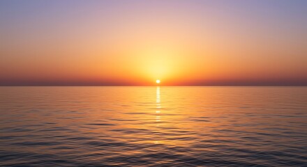 Sunset over ocean calm water horizon