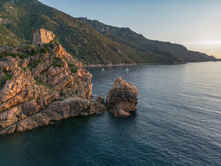 Aerial view town ruins Genoese tower of Porto Corsica France medieval watchtower Mediterranean Sea...