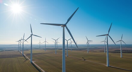 Wind Turbines in Bright Sunny Sky Over Open Rural Landscape with Clear Blue Sky