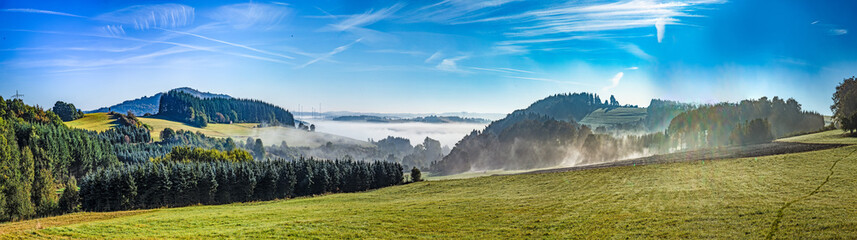 foggy rural landscape in morning in the eifel