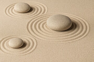 Obraz premium Close-up of Zen garden stones arranged on patterned sand