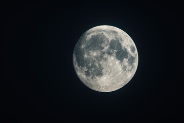 Obraz premium Stunning close-up of a luminous moon illuminating a night sky filled with craters and intricate textures, evoking a peaceful and mystical atmosphere for sky enthusiasts.