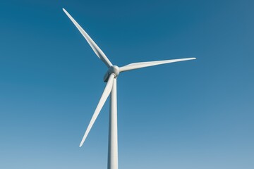 A traditional windmill set against a clear blue sky