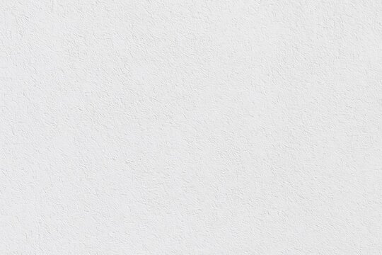 Light-colored textured wall surface ideal for presentations and web design with area for custom text