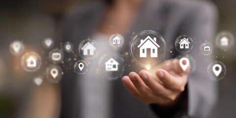 Hand holding virtual home icons