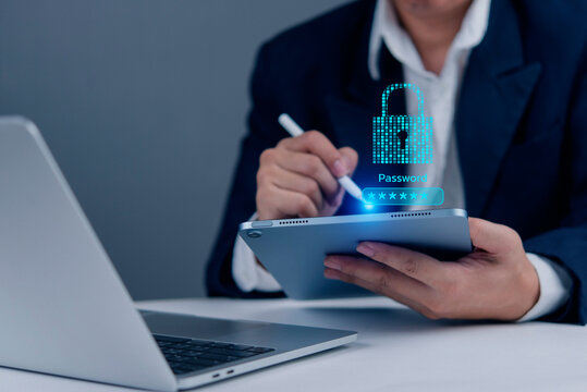 Business data security concept. A person entering a password on a tablet. Protecting online information, confidential data, and smart access. Data breach prevention and secure system.
