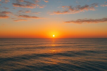 Fototapeta premium Bright amber dawn illuminating the sea