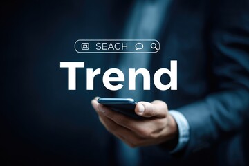 Businessperson holds phone with a search bar and the word "Trend" displayed