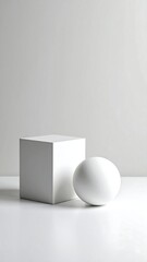 White cube and sphere on plain background