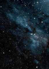 Obraz premium The night sky is filled with numerous stars and wispy clouds overhead