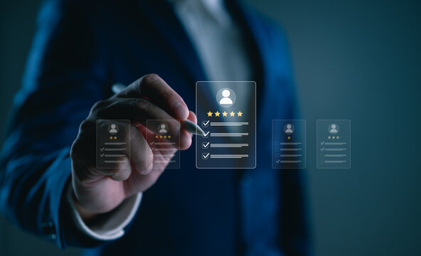 Businessman selecting top-rated candidate with digital interface, HR technology concept showing employee evaluation, recruitment and performance management in modern workplace. HR, HRM concept.