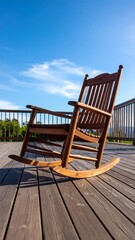 Wooden rocking chair on a deck, sunny day