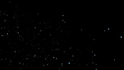 Floating blue dust particles in dark background