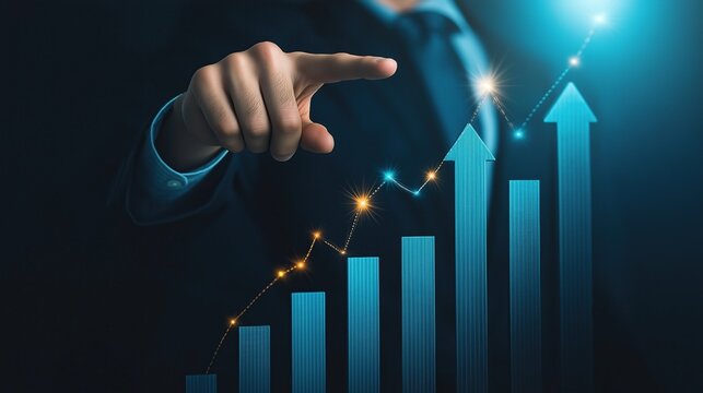 Businessman pointing at upward arrows on bar graph with blue background representing growth success and financial data concept for business inspiration technology and stock market trends