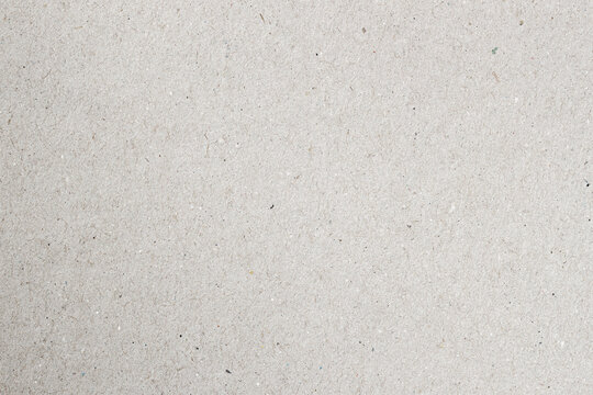 Neutral paper texture with subtle fibers and natural grain in high resolution for use in design or mockups. Concept of paper background, eco texture, minimalist surface