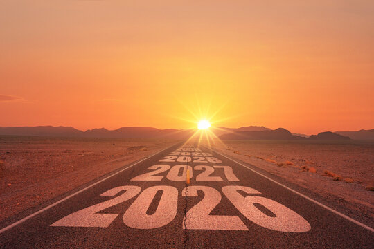 New year 2026. Straight road in desert with years 2026 to 2030 marked on the asphalt, leading toward a glowing sunrise. Symbol of future, goals, planning, new beginnings, and long-term vision. Sunset