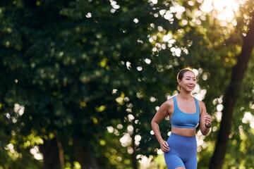 Woman Jogging Outdoors in Nature During a Sunny Summer Morning