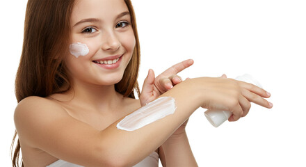 Smiling young girl applying moisturizer to her arm and face against a bright white backdrop