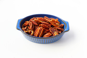 Delicious salted pecan nuts scattered.