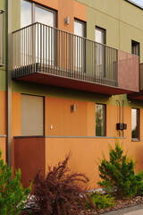 modern architectural facade featuring bright colors with sleek balcony design. contemporary panels...