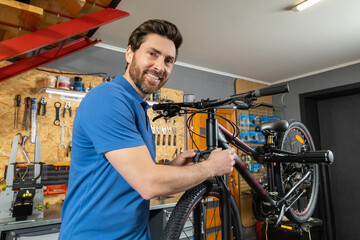 Mechanic with bike in garage
