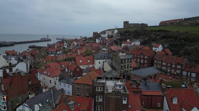 Aerial video captured with DJI Mini 3 Pro, lifting off near Endeavour Wharf, crossing the River Esk, and rising over Whitby town towards the iconic Abbey.